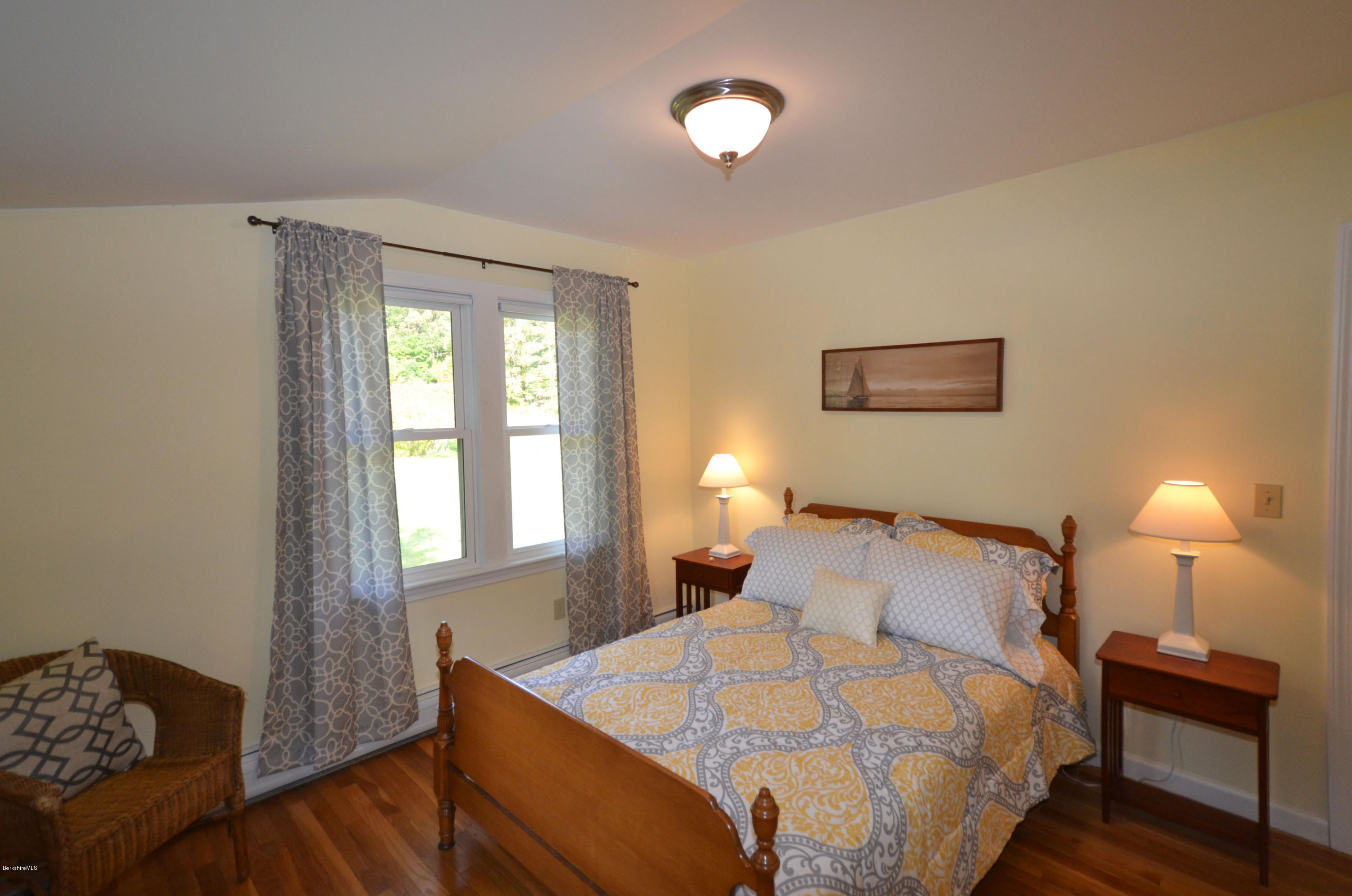 2127 Hancock Road Hancock, MA 01267 - Photo 29 of 53 a bedroom with a bed and a lamp
