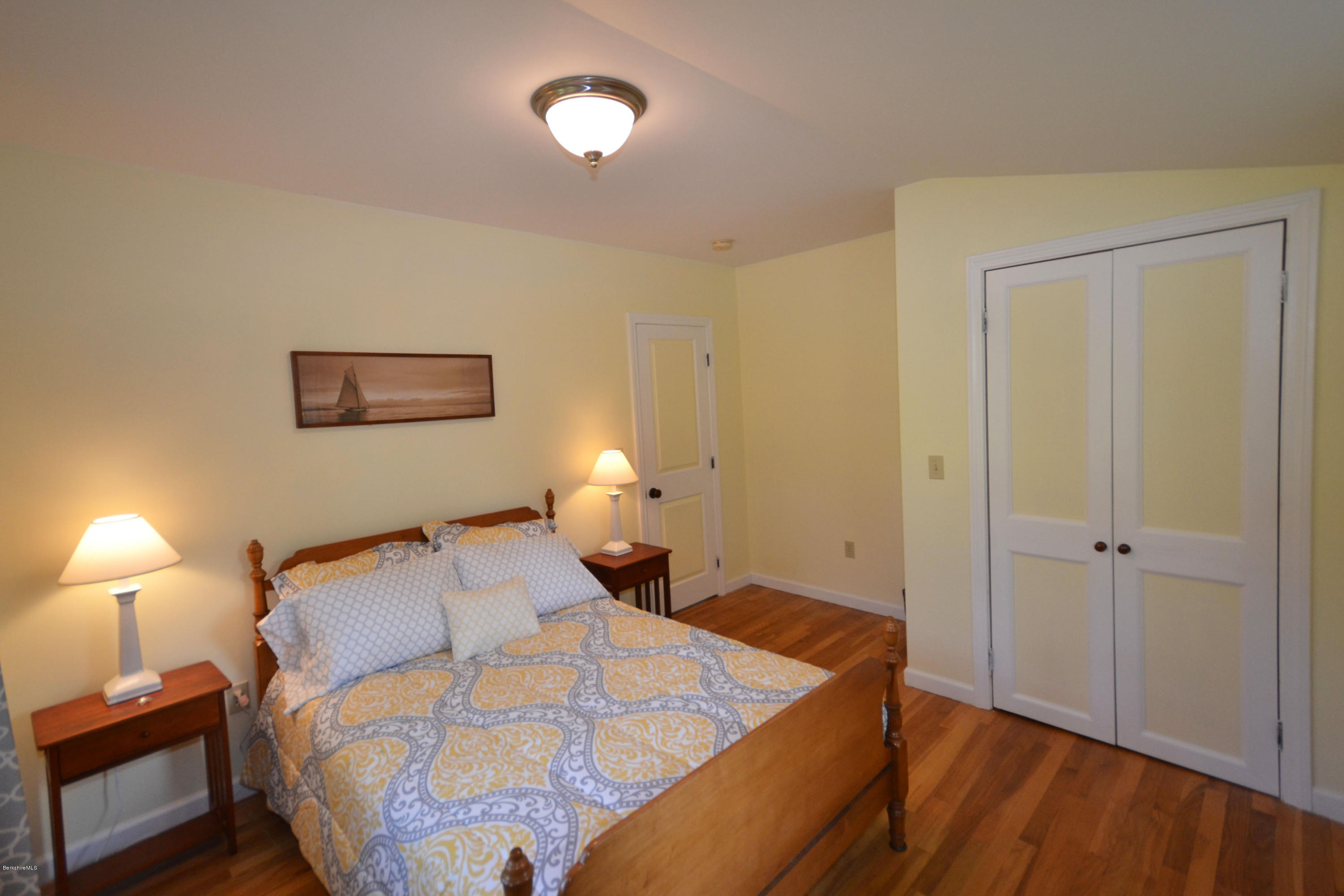 2127 Hancock Road Hancock, MA 01267 - Photo 30 of 53 a bedroom with a bed and a lamp