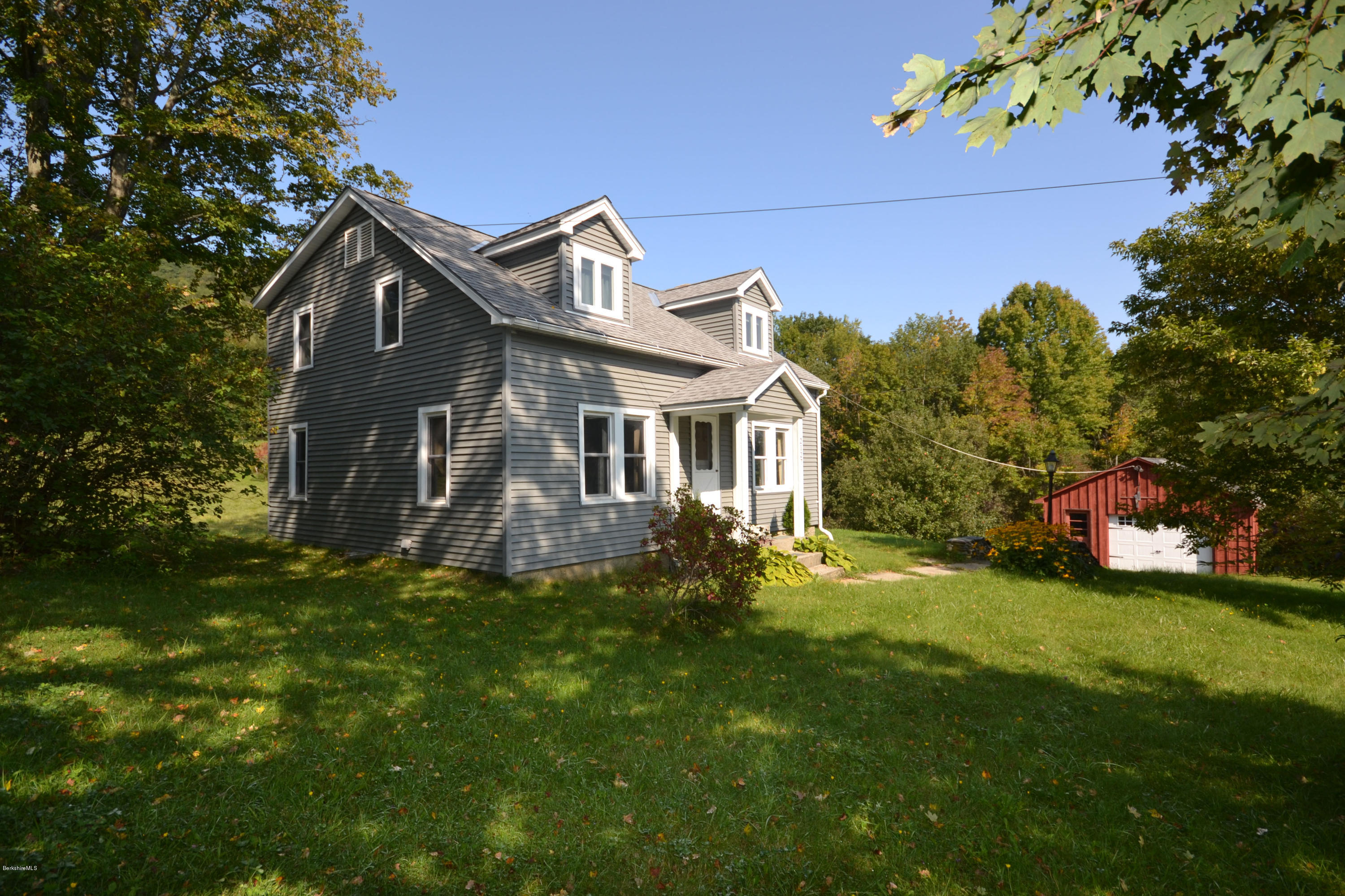 2127 Hancock Road Hancock, MA 01267 - Photo 4 of 53 a front view of a house with a garden