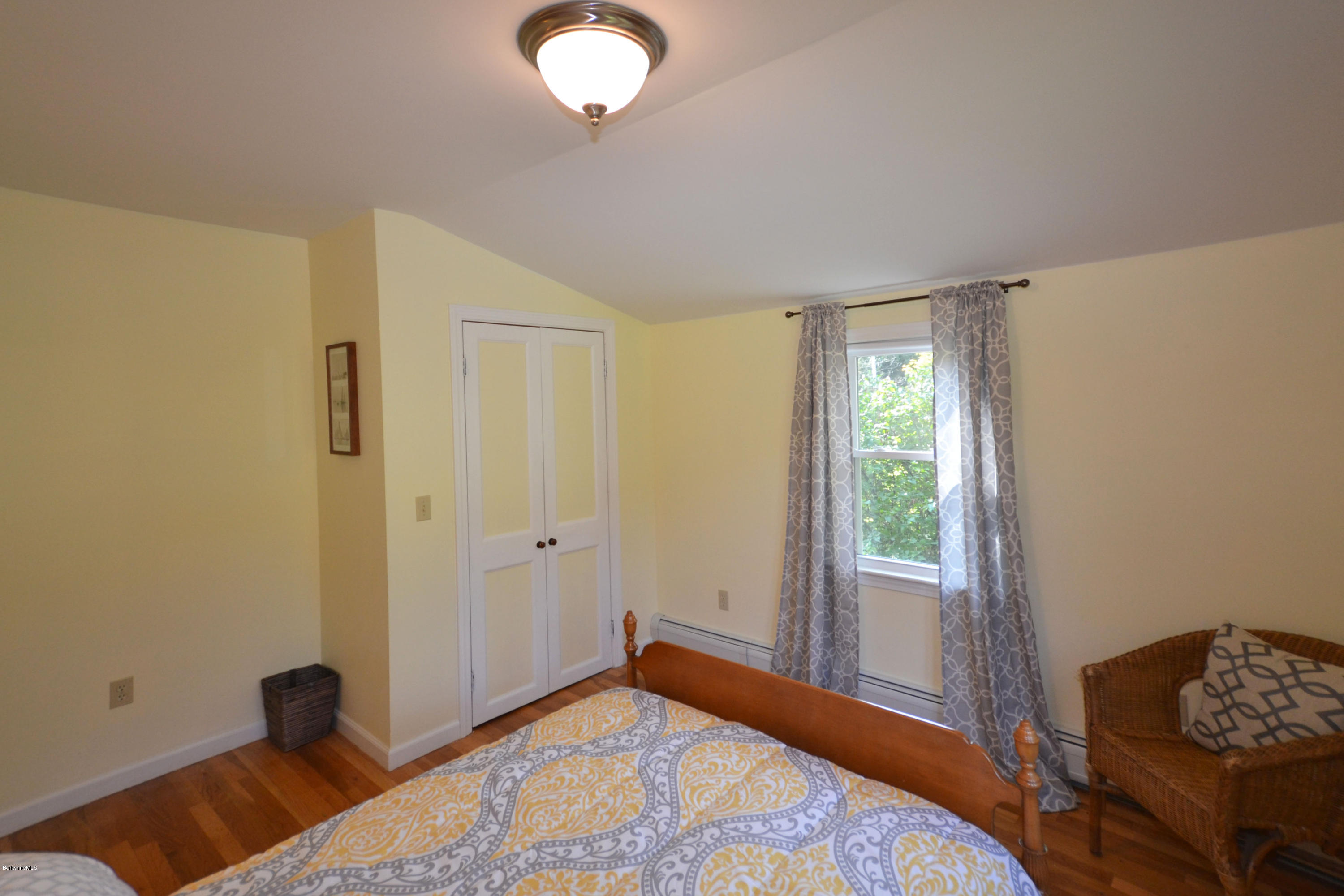 2127 Hancock Road Hancock, MA 01267 - Photo 31 of 53 a bedroom with a bed and a window