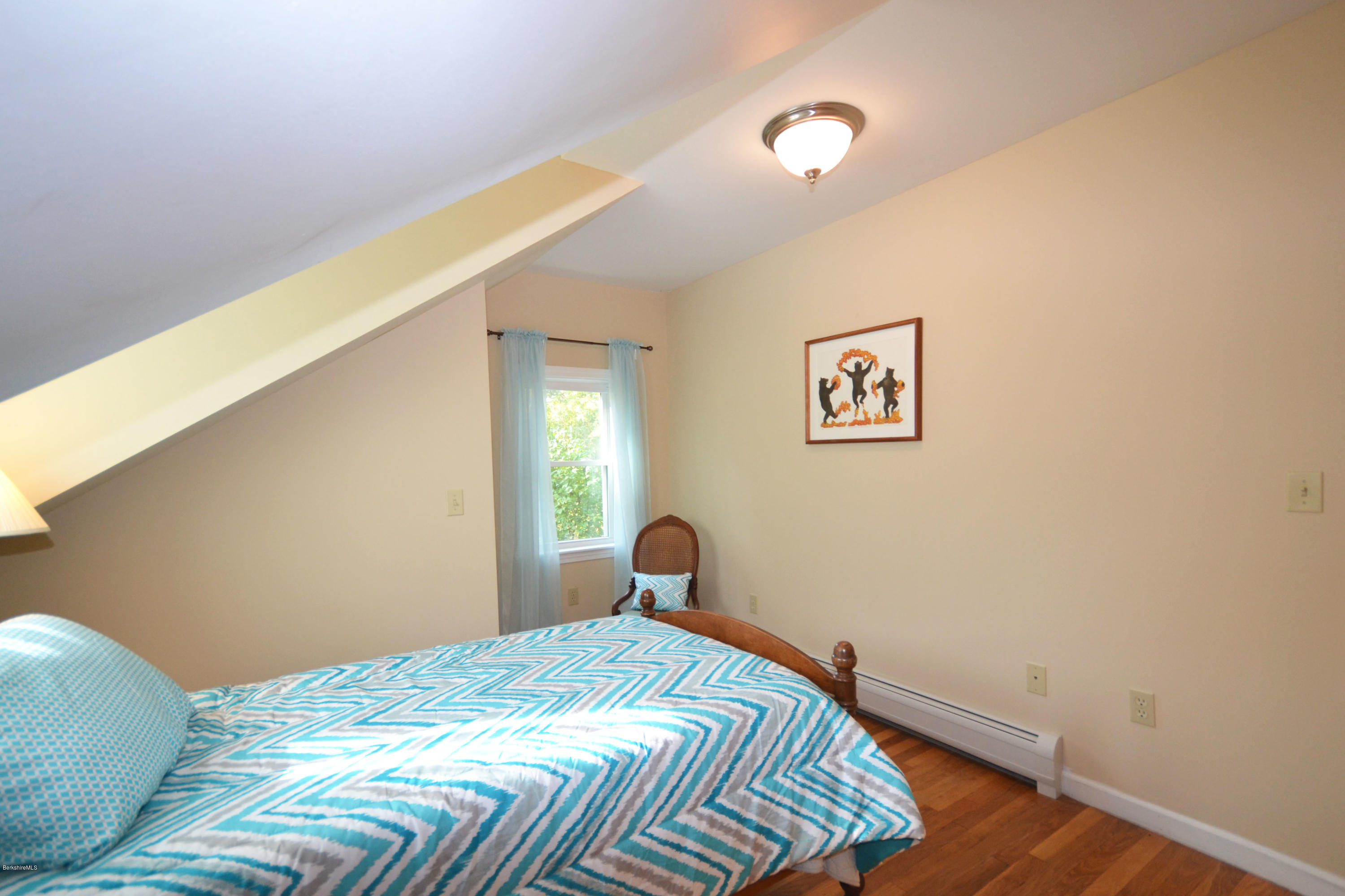 2127 Hancock Road Hancock, MA 01267 - Photo 34 of 53 a bedroom with a bed and a window