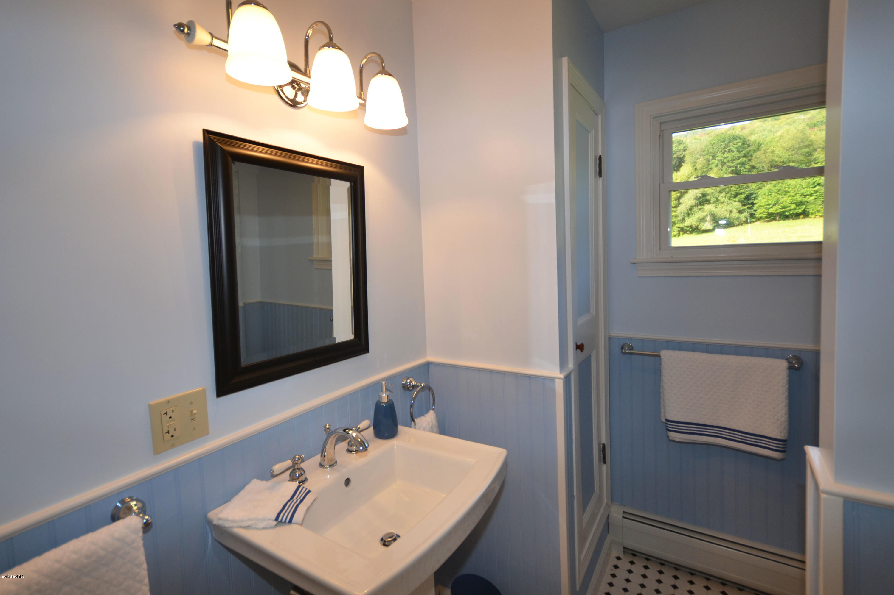 2127 Hancock Road Hancock, MA 01267 - Photo 36 of 53 a bathroom with a sink a mirror and a window