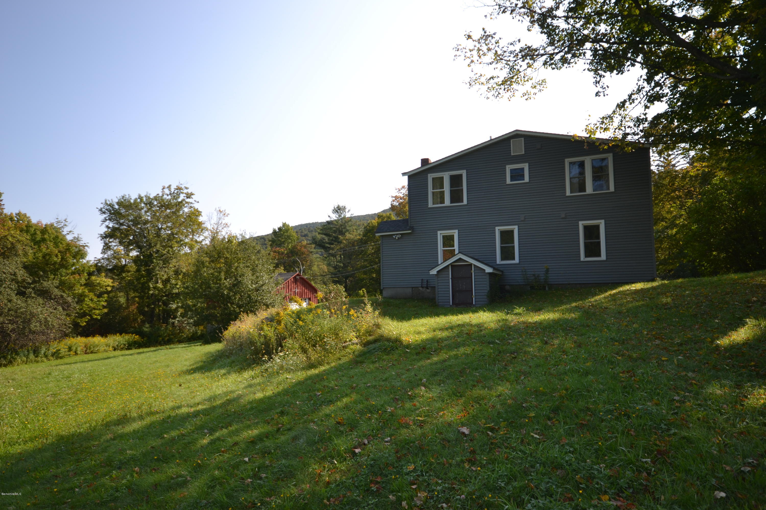 2127 Hancock Road Hancock, MA 01267 - Photo 41 of 53 a brick house with a big yard and large trees