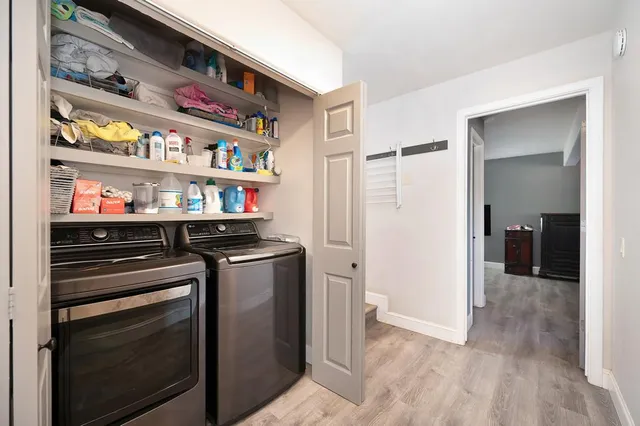 a kitchen view of a stove and a refrigerator