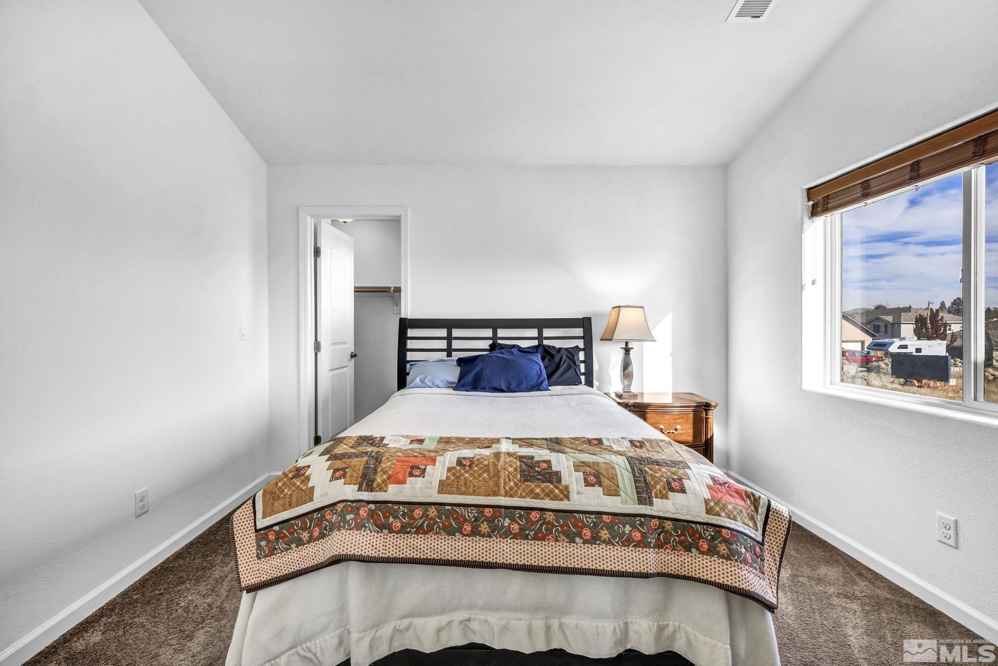 2705 Gulling Court Reno, NV 89503 - Photo 15 of 40 a bedroom with a bed and window