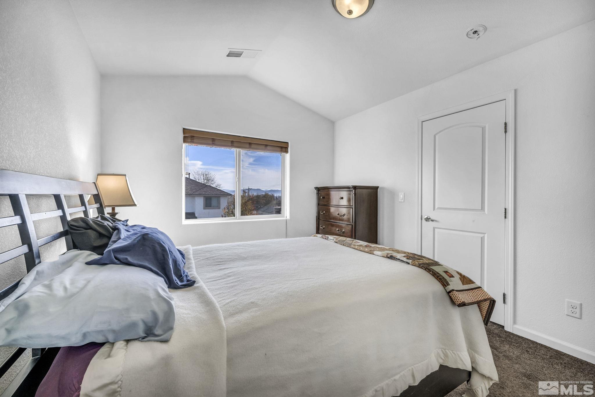2705 Gulling Court Reno, NV 89503 - Photo 34 of 40 a bedroom with a bed and a window