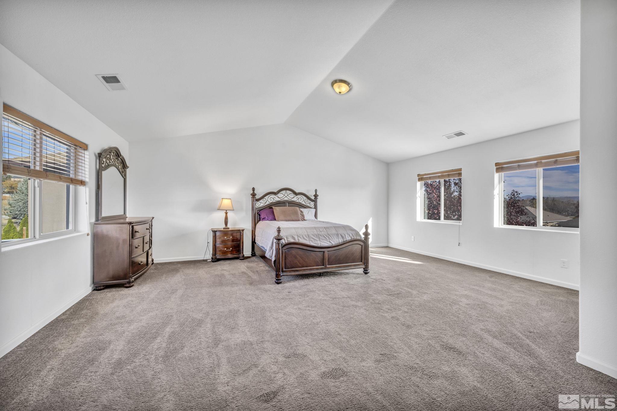 2705 Gulling Court Reno, NV 89503 - Photo 7 of 40 a bedroom with a bed and a window