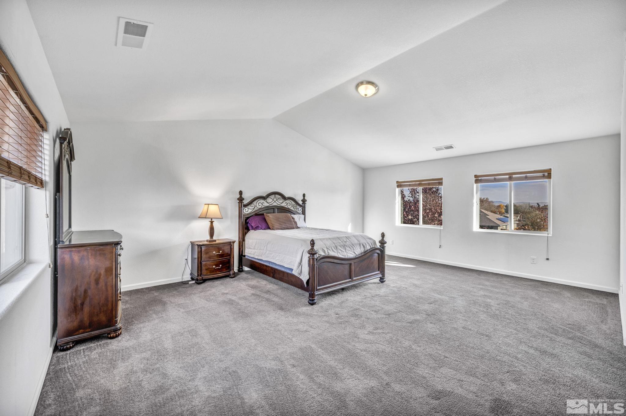 2705 Gulling Court Reno, NV 89503 - Photo 8 of 40 a bedroom with a bed and a couch