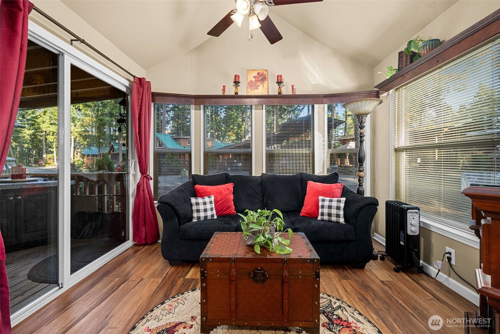 1546 Reservation Road Southeast, Unit 218 Olympia, WA 98513 - Photo 2 of 40 a living room with furniture and a floor to ceiling window