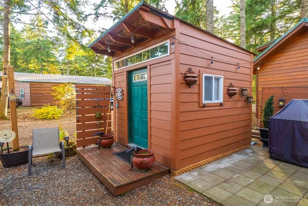 a yellow and red brick house with a large window
