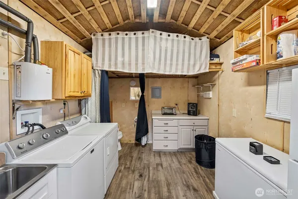 a kitchen with a sink a stove and cabinets