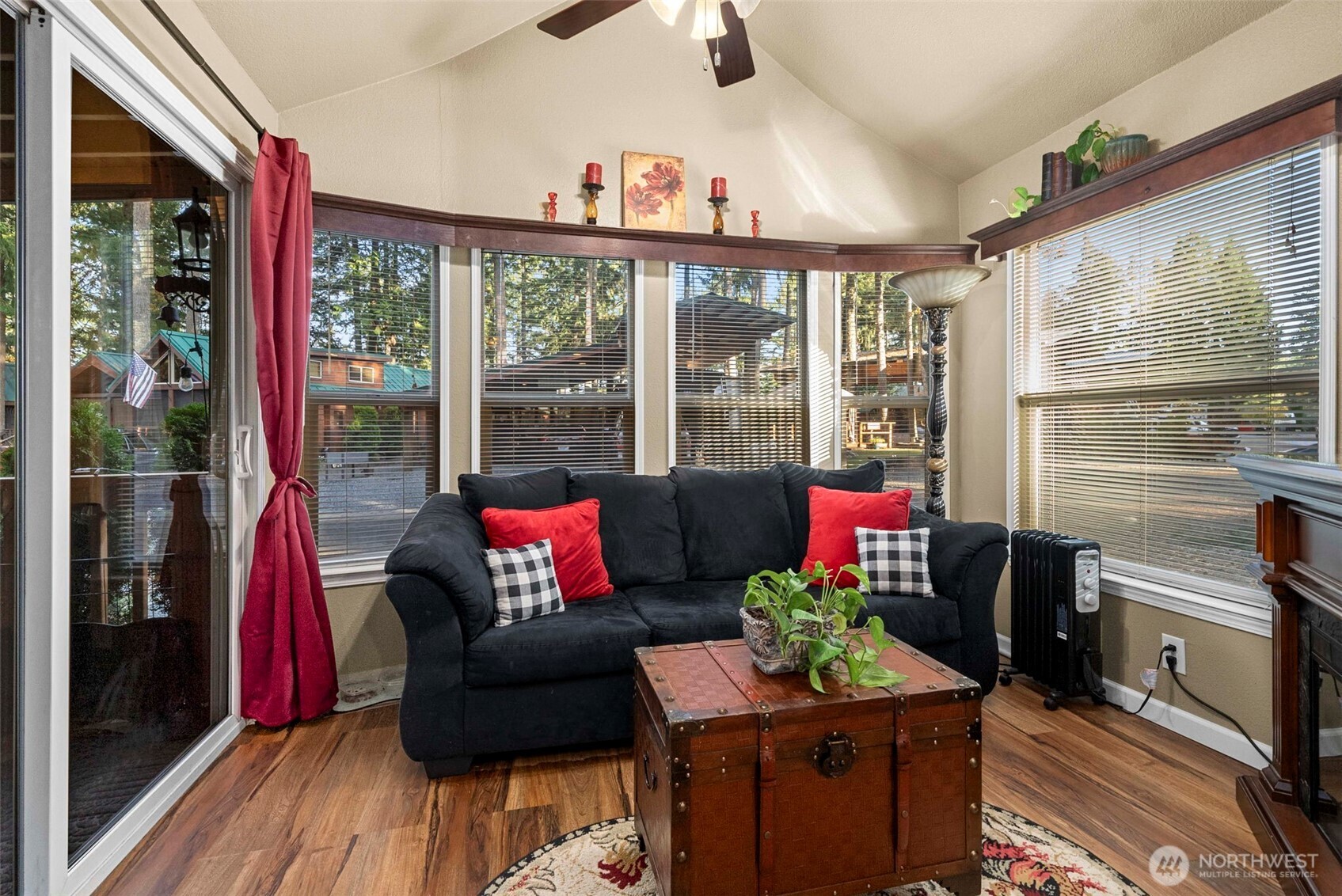 1546 Reservation Road Southeast, Unit 218 Olympia, WA 98513 - Photo 3 of 40 a living room filled with furniture and a floor to ceiling window