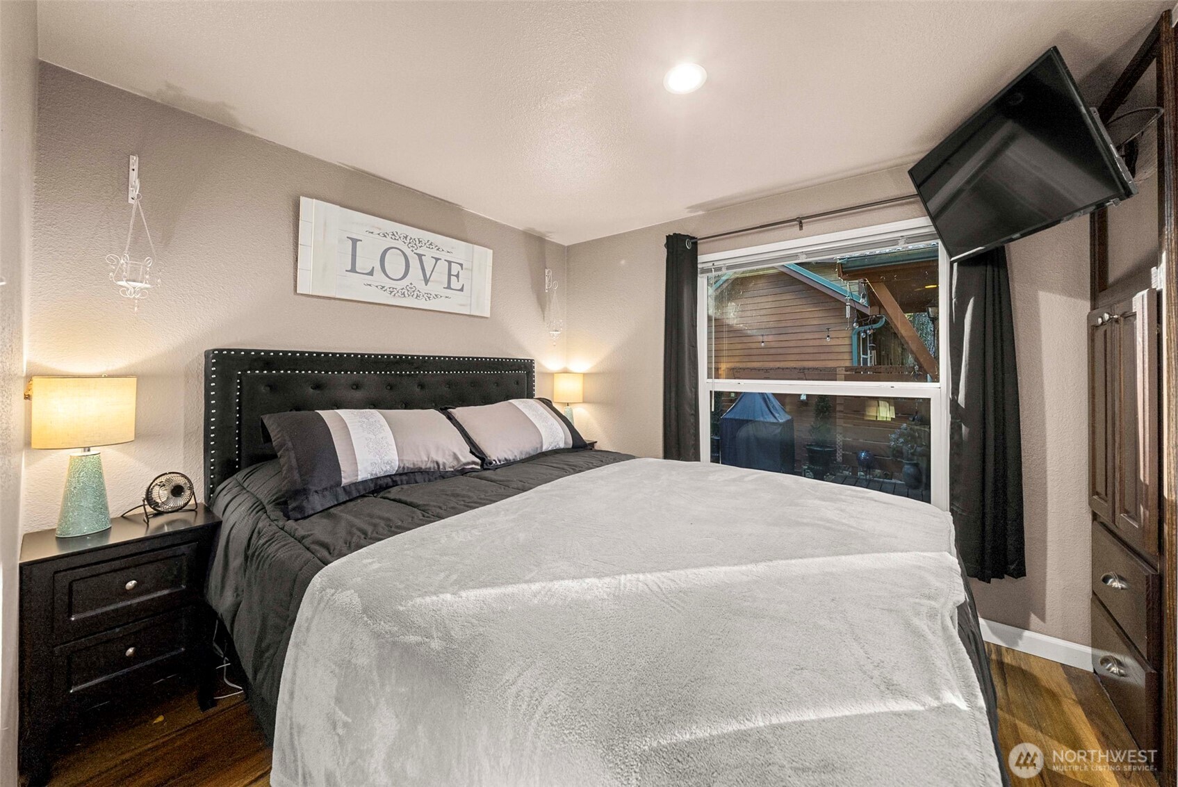 1546 Reservation Road Southeast, Unit 218 Olympia, WA 98513 - Photo 10 of 40 a bedroom with a bed and a mirror