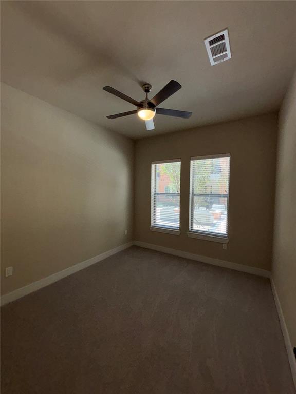 111 Town Place, Unit 2610 Fairview, TX 75069 - Photo 8 of 31 an empty room with a window and a ceiling fan
