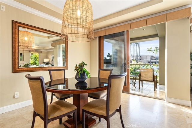 a view of a dining room with furniture and a table