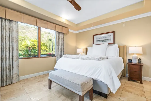 a spacious bathroom with a double vanity sink toilet mirror and shower