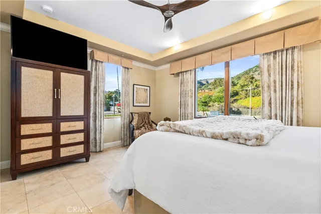 a bathroom with a granite countertop sink a mirror and shower