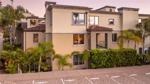 a kitchen with stainless steel appliances granite countertop a sink and a refrigerator