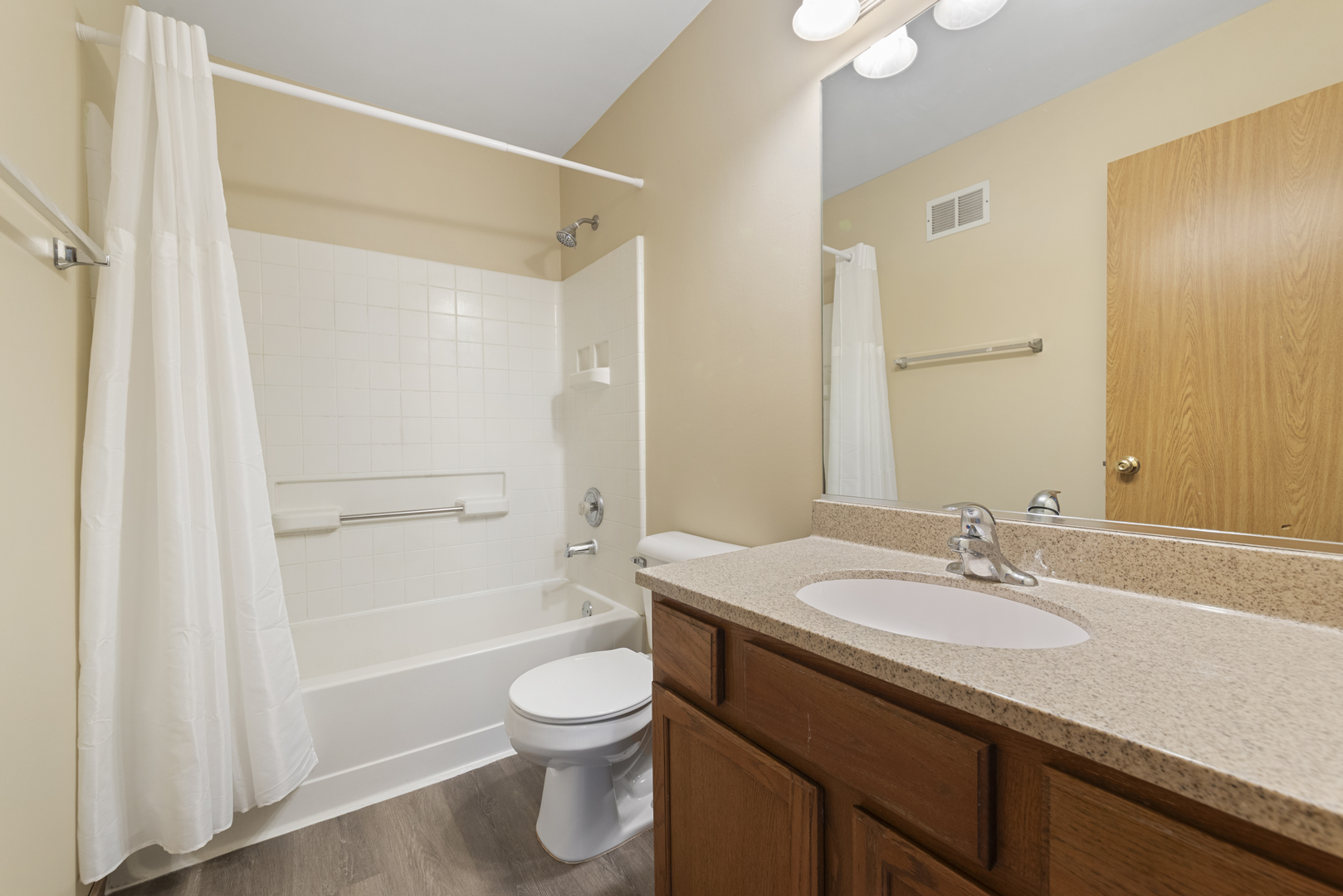 1011 Symphony Drive Aurora, IL 60504 - Photo 14 of 16 a bathroom with a sink a toilet and shower
