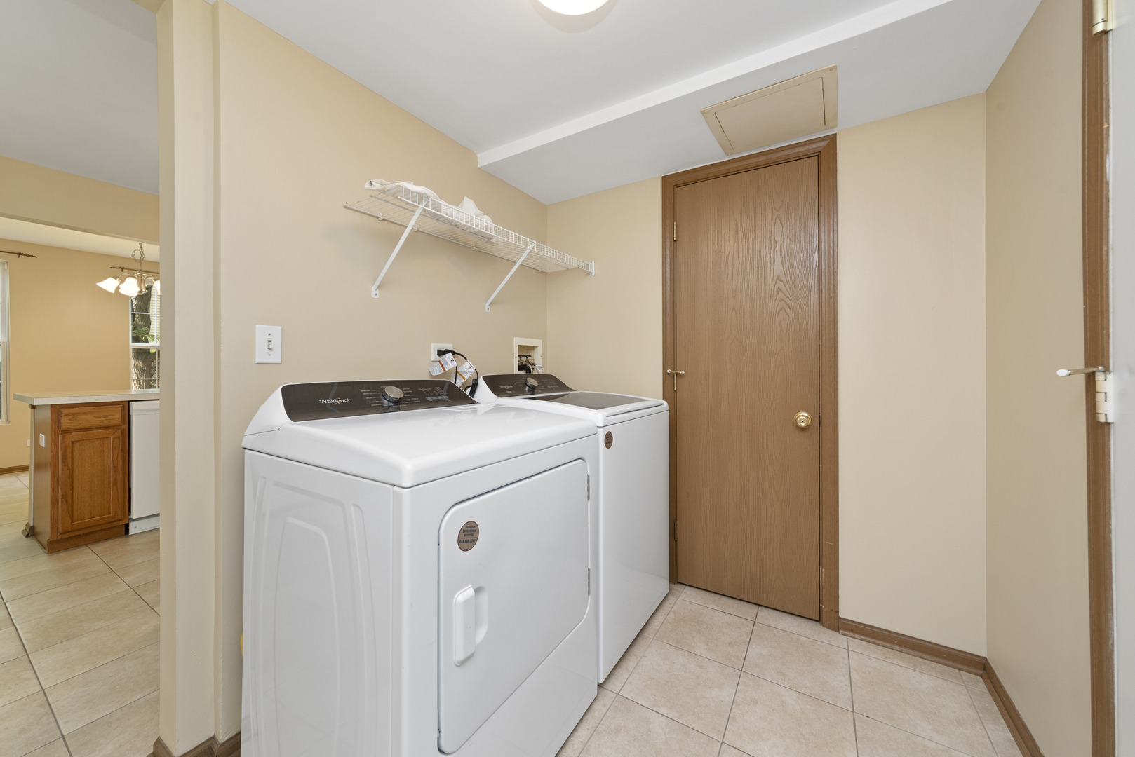 1011 Symphony Drive Aurora, IL 60504 - Photo 15 of 16 a utility room with dryer and washer