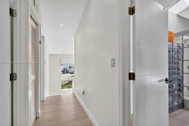 a view of a hallway with a room