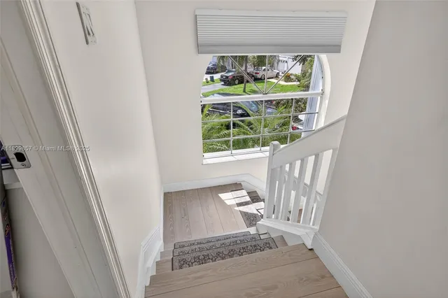 a view of a porch with a table and chair