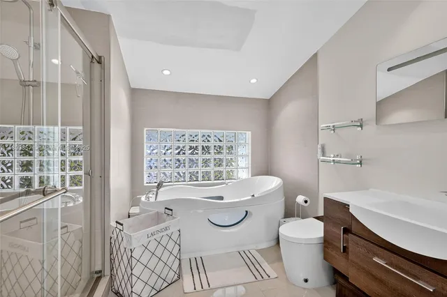 a bathroom with a toilet a sink and a bathtub