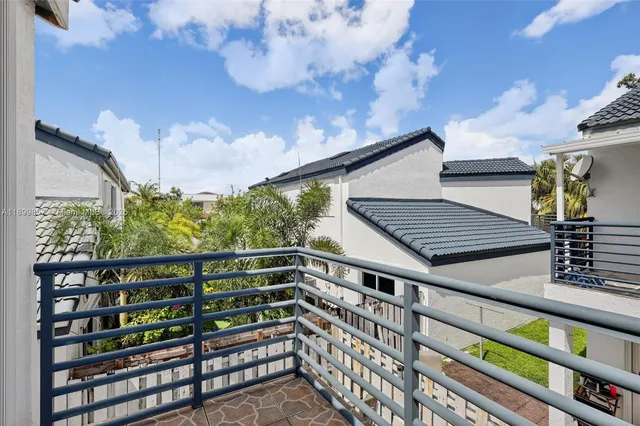 a view of a roof deck with wooden fence