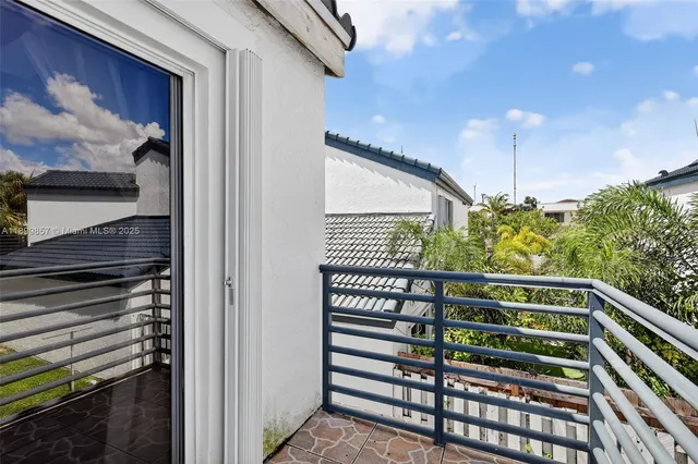 a balcony view with an outdoor seating