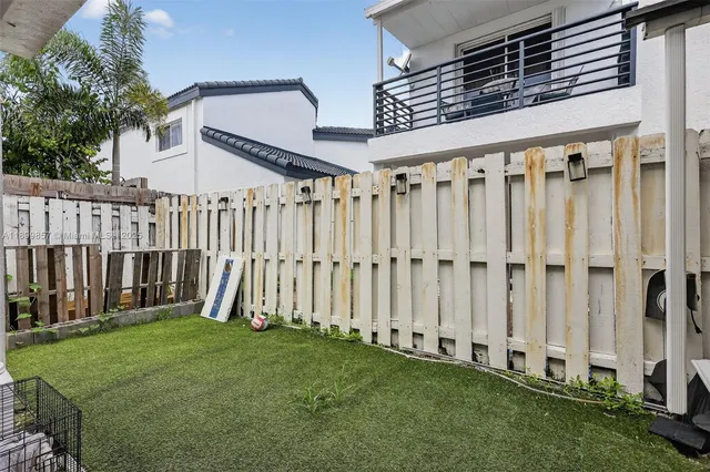 a view of living room filled with furniture and a rug