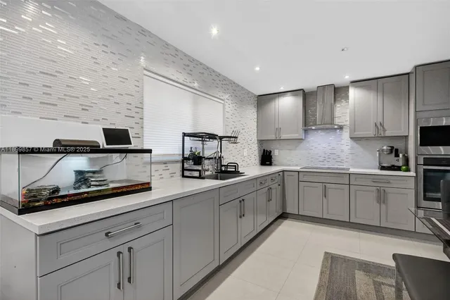 a kitchen with sink cabinets and microwave