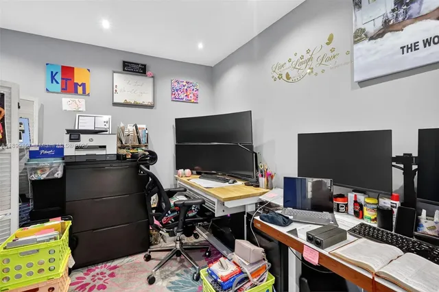 a room with furniture and a flat screen tv