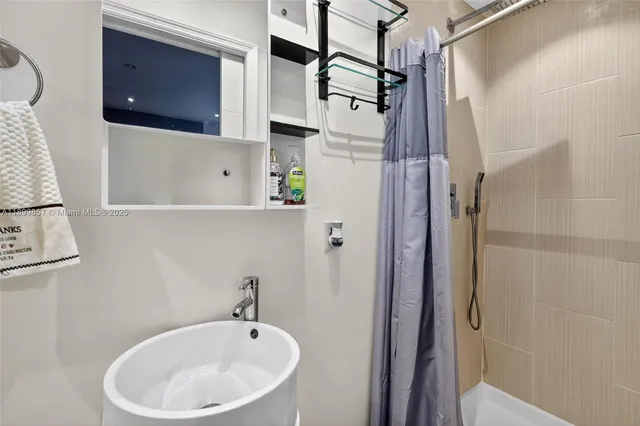 a bathroom with a sink and a shower