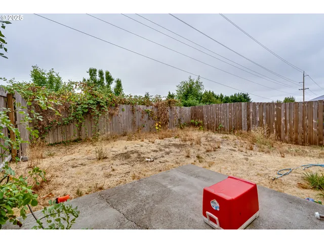 a view of a backyard of the house