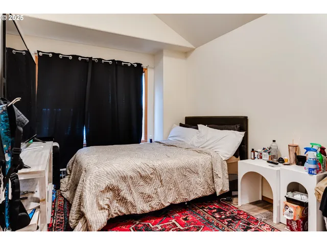 a bedroom with a bed and a closet