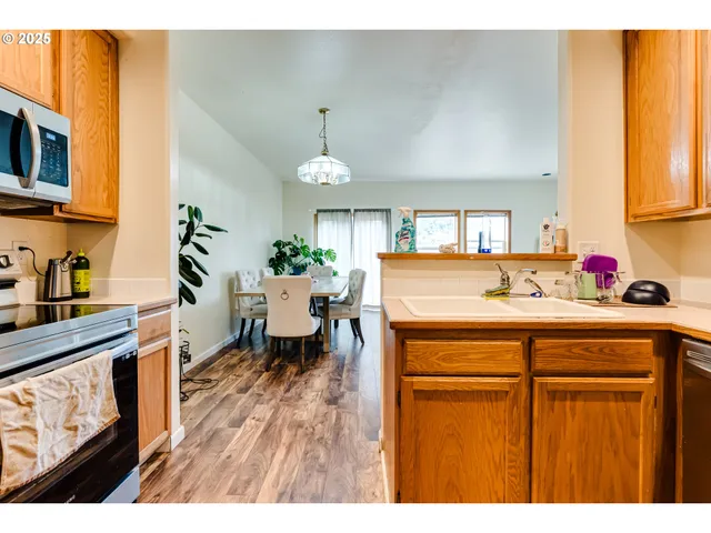 a living room with a sink and dishwasher