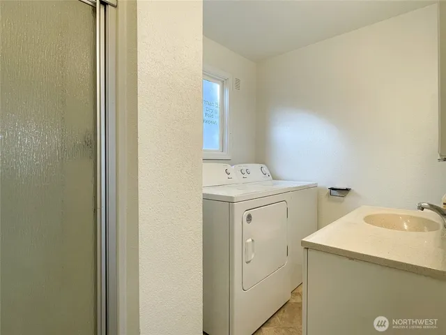 a utility room with dryer and washer