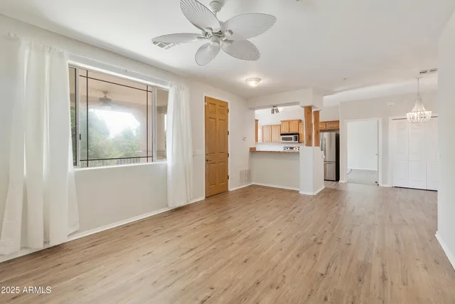 a view of a kitchen with a stove cabinets and wooden floor