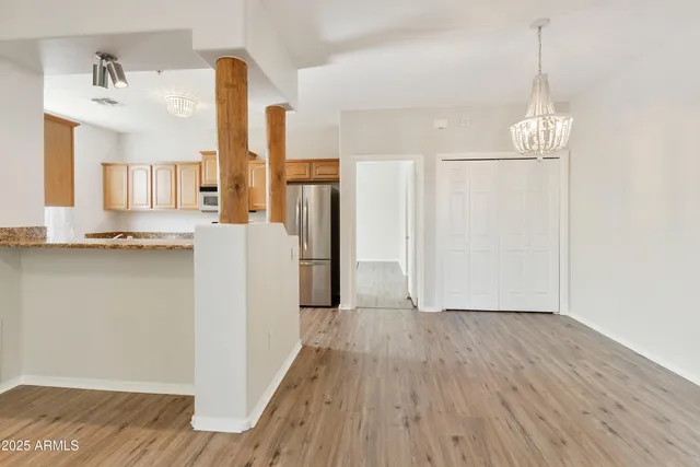 a view of kitchen with furniture and wooden floor