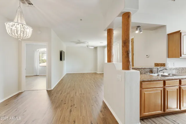 a view of a kitchen cabinets and wooden floor