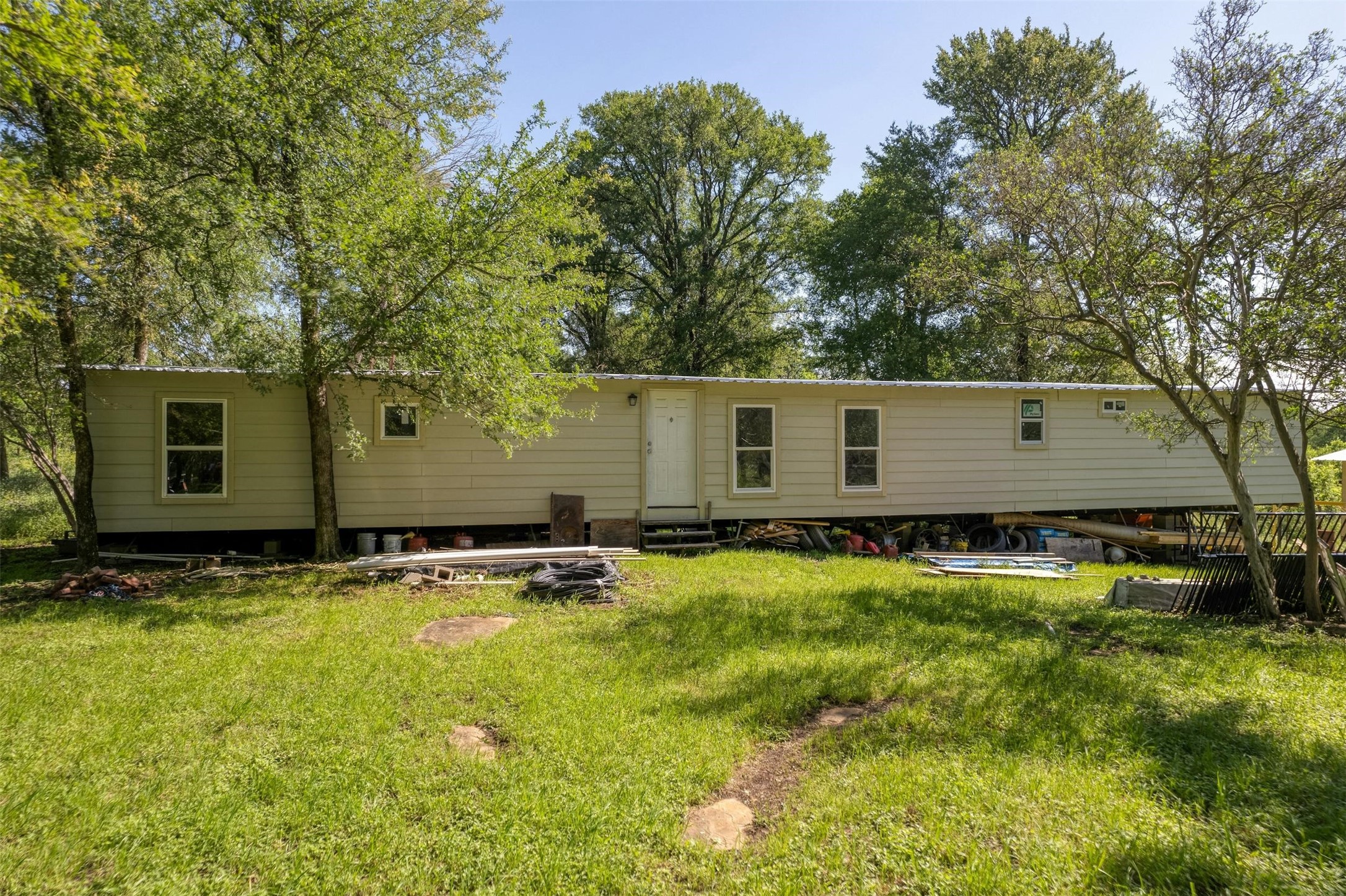 201 Fawn Ridge Road Cedar Creek, TX 78612 - Photo 21 of 21 a backyard of a house with yard and outdoor seating