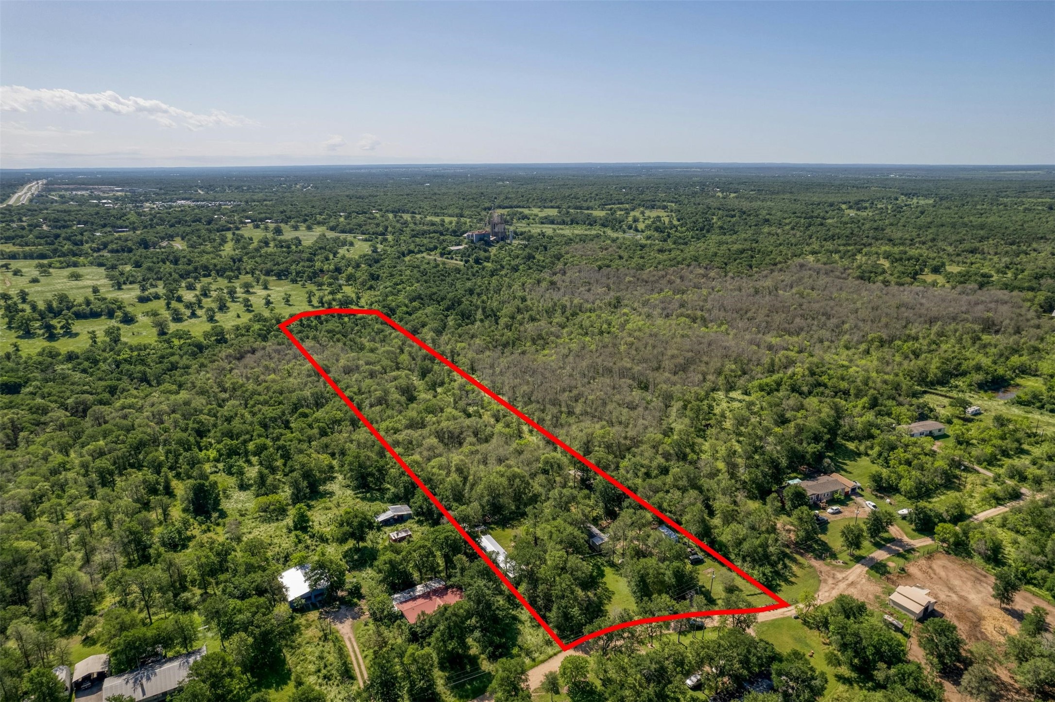 201 Fawn Ridge Road Cedar Creek, TX 78612 - Photo 3 of 21 a view of a lush green field