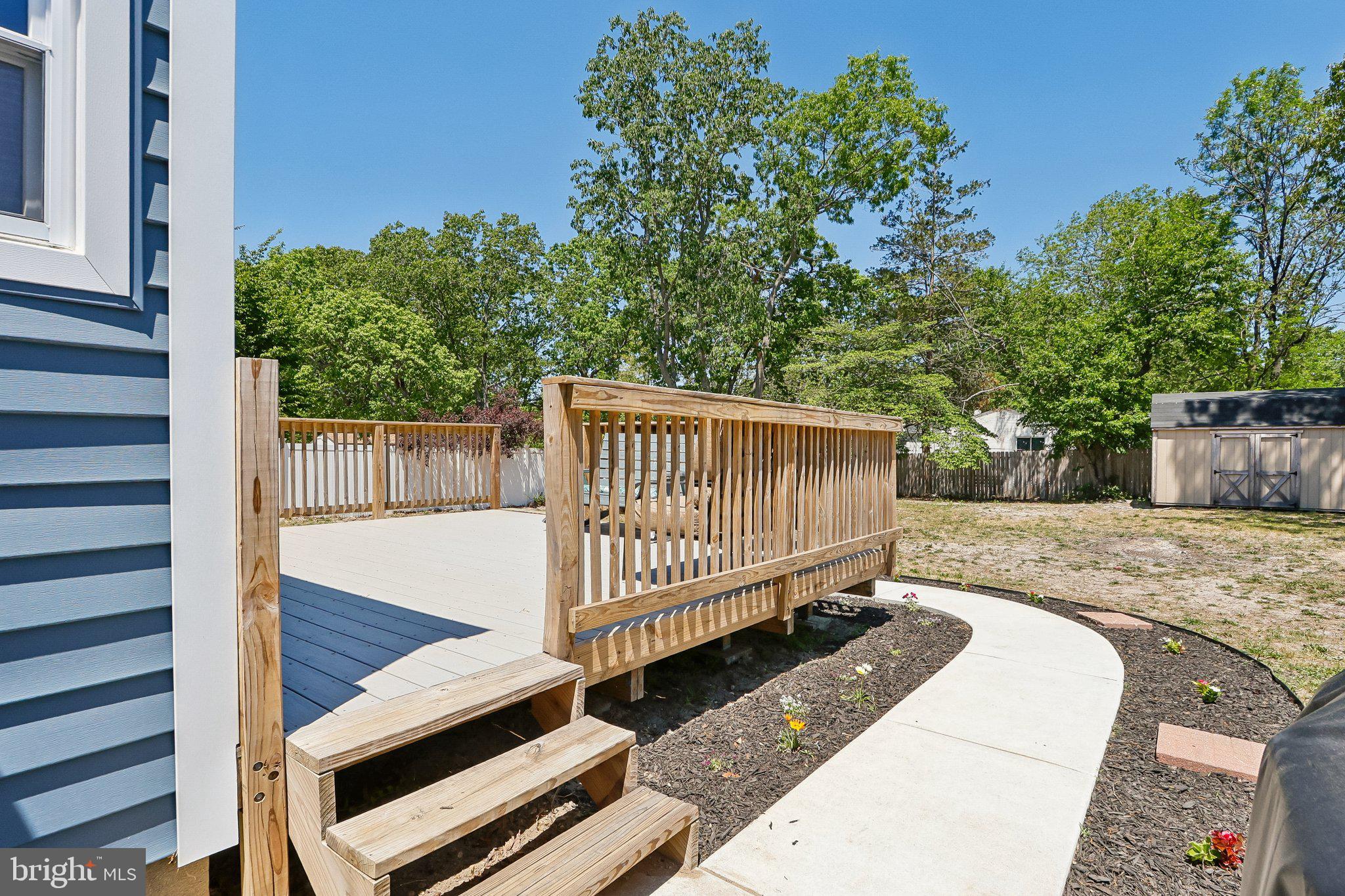 73 Burnt Tavern Road Brick, NJ 08724 - Photo 23 of 31 a view of a backyard with a deck