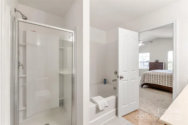 a bathroom with a shower and toilet