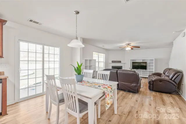 a view of a livingroom with furniture window and wooden floor