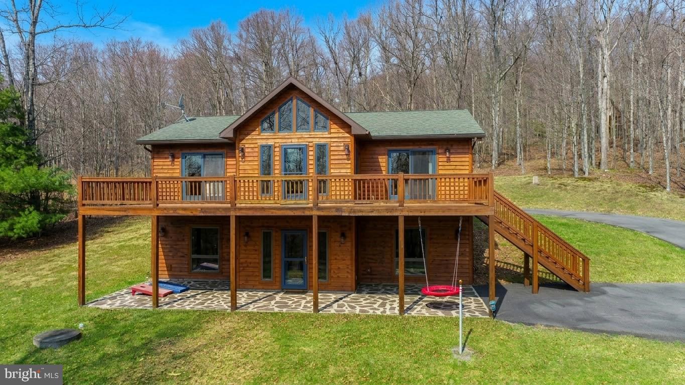 167 Sears Lane Swanton, MD 21561 - Photo 1 of 48 a front view of a house with garden