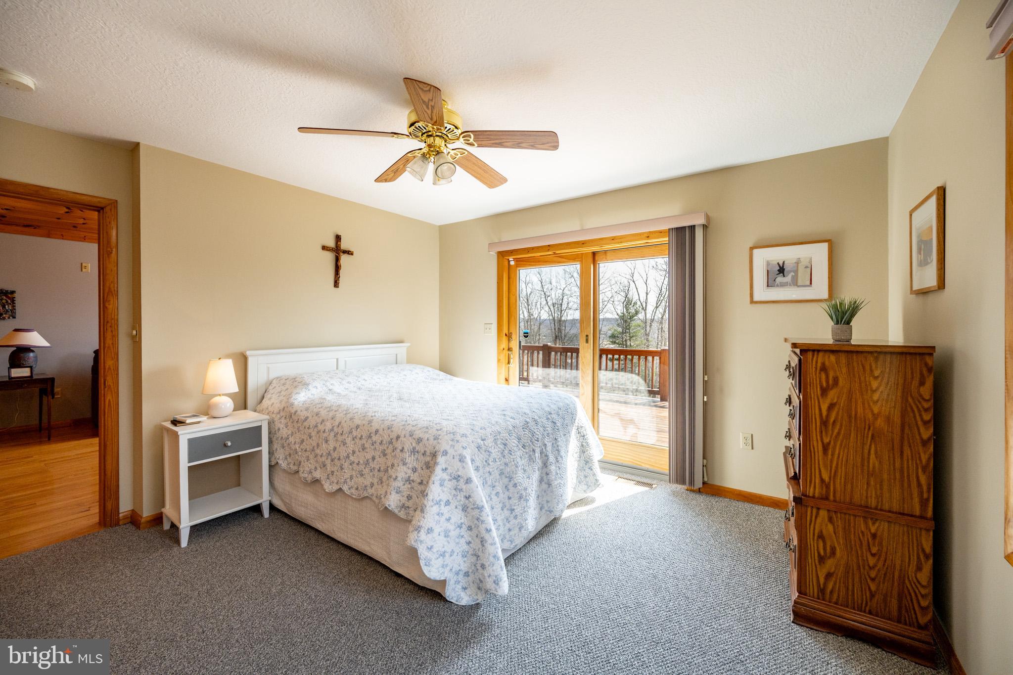 167 Sears Lane Swanton, MD 21561 - Photo 18 of 48 a bedroom with a bed and a chandelier