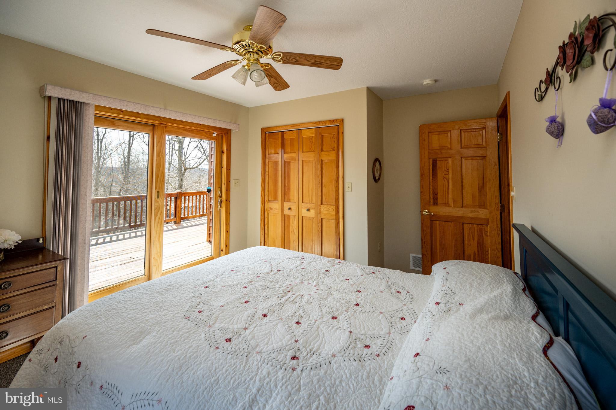 167 Sears Lane Swanton, MD 21561 - Photo 27 of 48 a bedroom with a large bed and a window