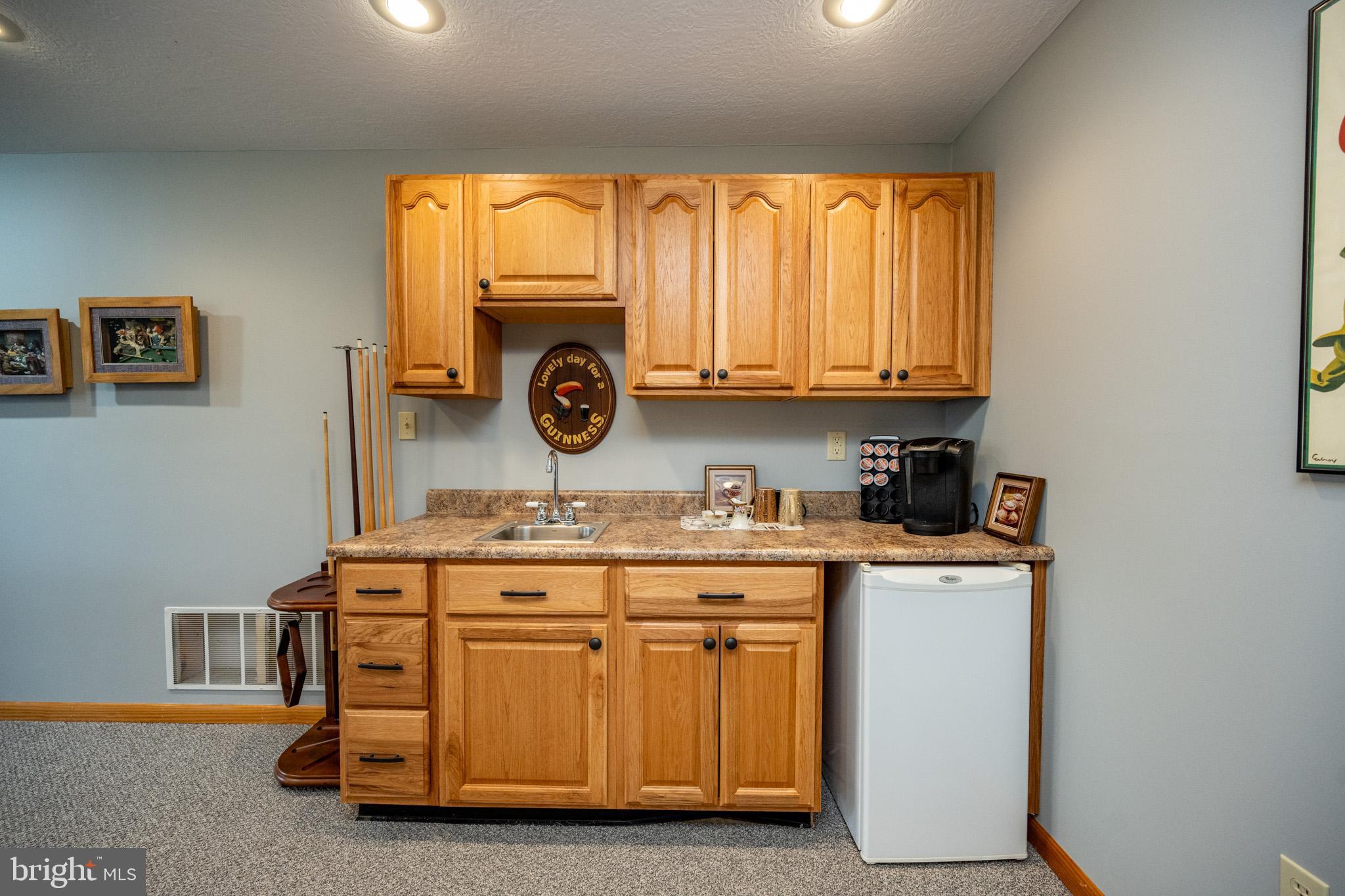 167 Sears Lane Swanton, MD 21561 - Photo 35 of 48 a utility room with stainless steel appliances granite countertop a stove and a refrigerator