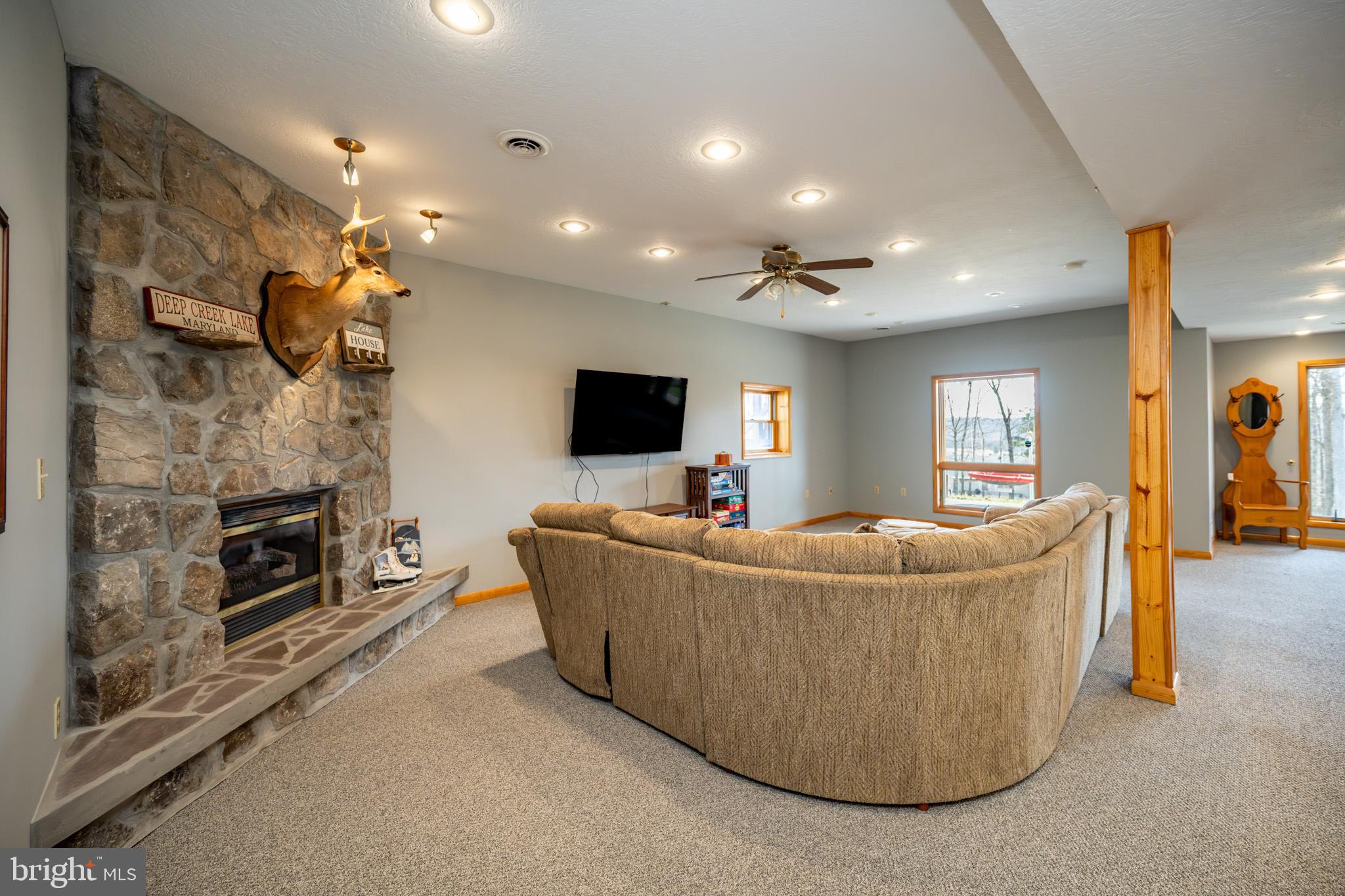 167 Sears Lane Swanton, MD 21561 - Photo 36 of 48 a living room with furniture and a flat screen tv